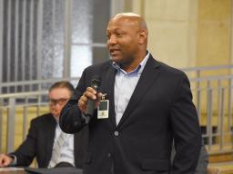 A Reentry Coordination Council member shares his knowledge of obstacles to re-entry with the participants.