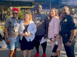 Deputy Attorney General Lisa O. Monaco stands with law enforcement officers on National Night Out in Charleston, S.C.