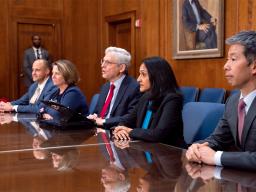 Attorney General Merrick B. Garland speaks among Justice Department officials in the Attorney General’s conference room
