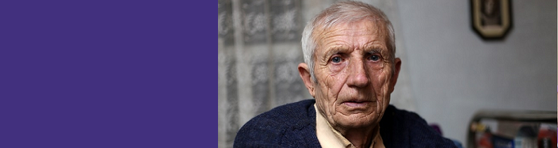 older man looking at camera