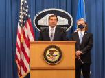 Assistant Attorney General For National Security John C. Demers at podium