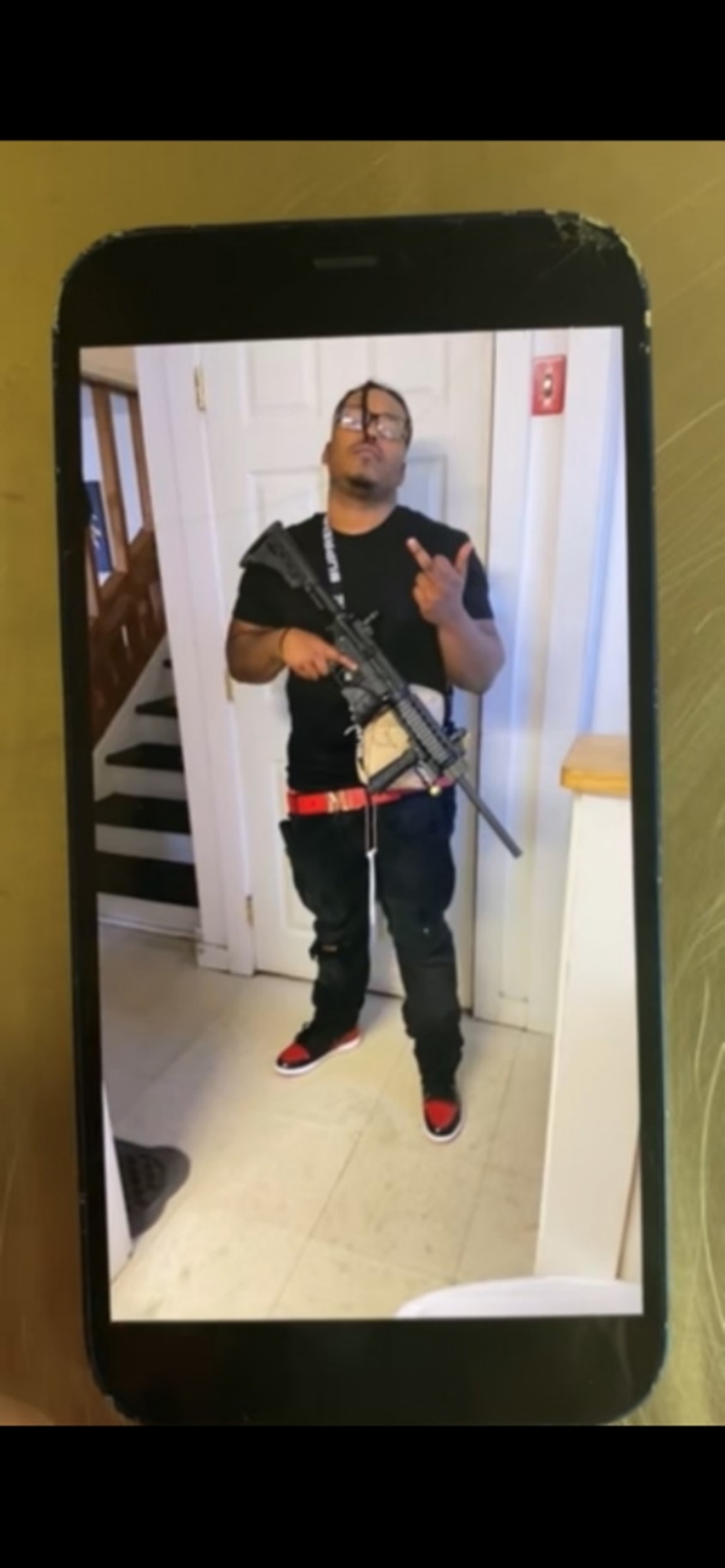 Picture of defendant with gun