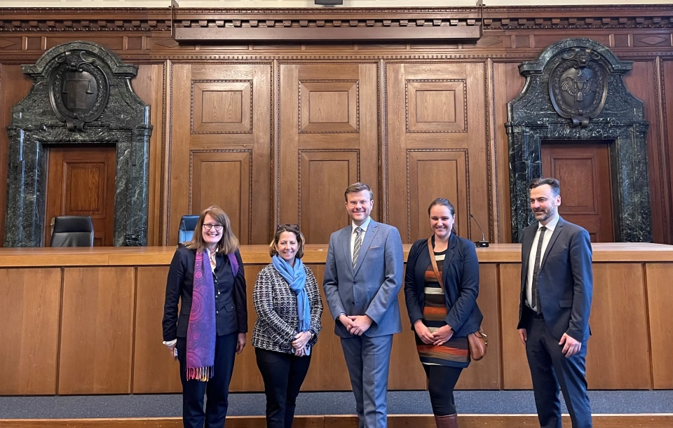 Deputy AG Monaco with others in the courtroom in the Palace of Justice where the leaders of the Nazi regime were tried before an International Military Tribunal following World War II. Deputy AG Monaco with others in the courtroom in the Palace of Justice where the leaders of the Nazi regime were tried before an International Military Tribunal following World War II.