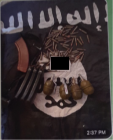 ISIS weaponry image Screenshots from a video depicting tactical gear, ammunition, and grenades on top of an ISIS flag