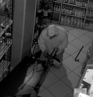 Picture of defendant stealing from an ATM