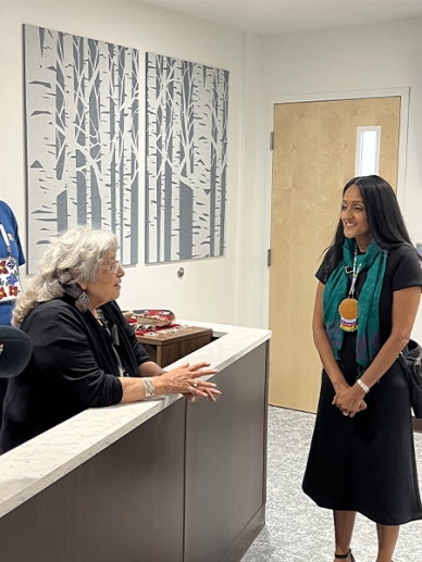 Associate Attorney General Gupta (right) speaking with Associate Justice Brenda Moose, of the Mille Lacs Band Central Court of Jurisdiction (left).