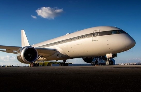 The Boeing, believed to be work $350 million. A side profile of the Boeing, bearing tail number P4-BDL and serial number 37306, parked on the ground.