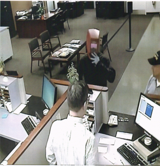 Photo of suspect wearing mask inside the bank Photo of suspect wearing mask inside the bank