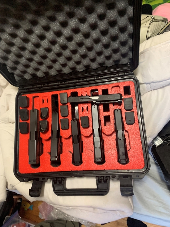 Travel case with handguns and clips