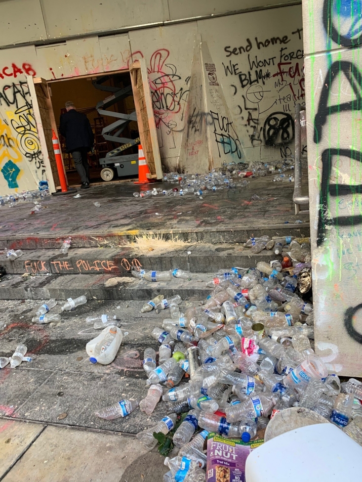 Water bottles used as projectiles piled near entrance to Hatfield Federal Courthouse