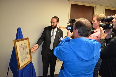 Assistant U.S. Attorney Thomas Palermo explains the document to the media