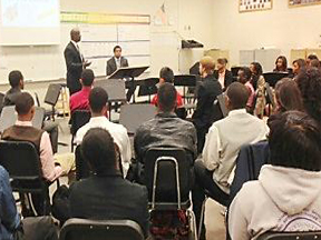Assistant U.S. Attorneys Loranzo M. Fleming and Brock Brockington speak to students at Meadow Creek High School in Norcross, Ga