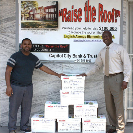 Assistant U.S. Attorney and Community Outreach Coordinator Loranzo M. Fleming (R) with English Avenue Neighborhood Association President Demarcus Peters (L)