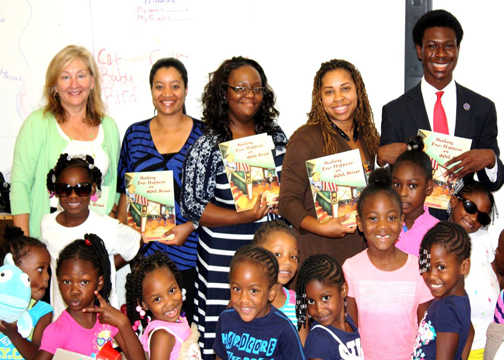 AUSA and Major Crimes Deputy Chief Katherine Hoffer, Paralegal Specialist Tammy Black, Student Volunteer Kimberly Wright,  Community Outreach Specialist Danielle Sweat, Atlanta Bar Association Summer Law Intern Jalen Coleman with 5-6 years old girls at Carver Family YMCA Summer Camp on July 15, 2014.